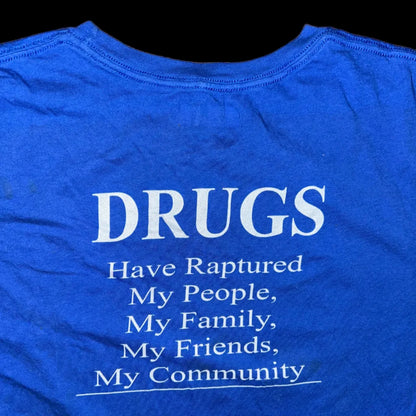 Blue shirt with white text on a wooden surface