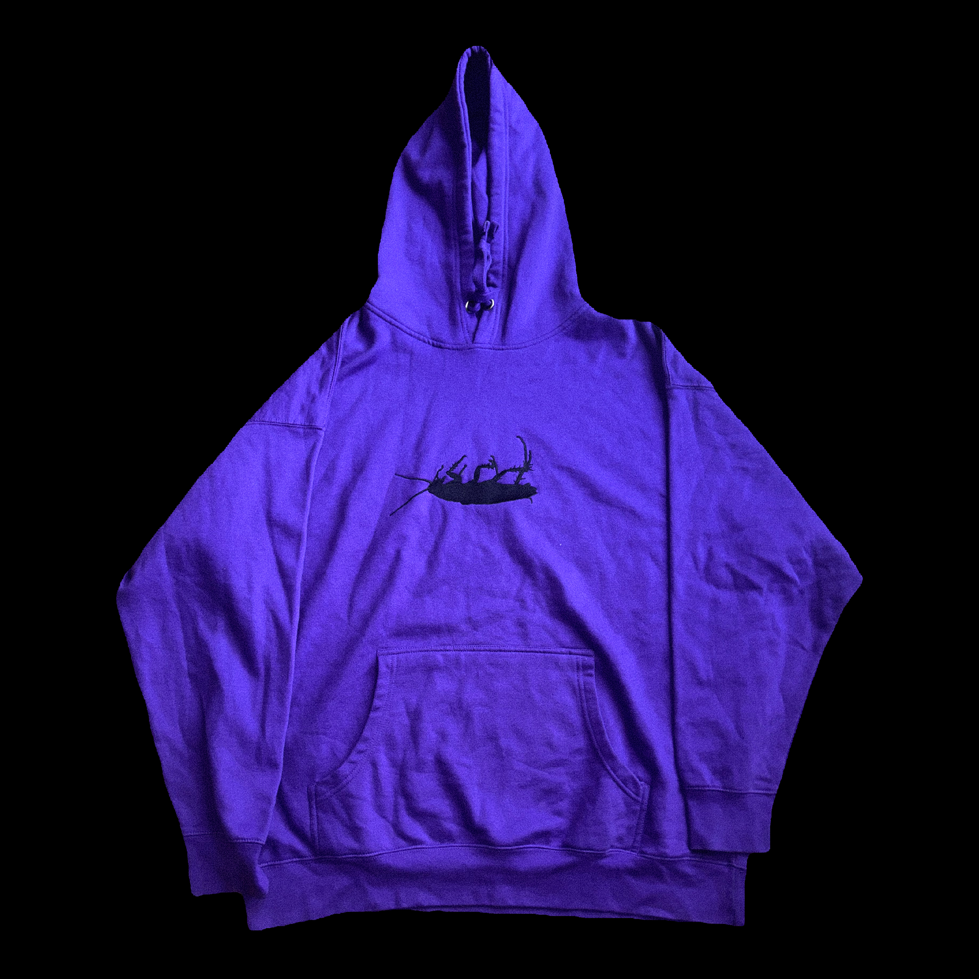 Purple hoodie with a black graphic on a black background